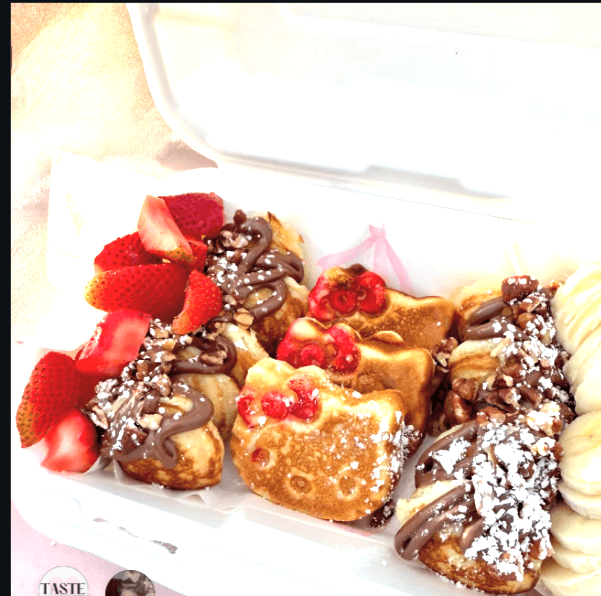 Hello Kitty shaped mini pancakes with fruit and toppings for parties