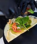 Savory crepe being prepared on the cart