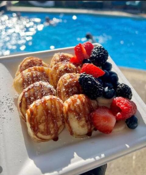 Berry mini buttermilk pancakes poolside